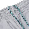 Close view of seafoam black and white drawcord on gray kids gi pants