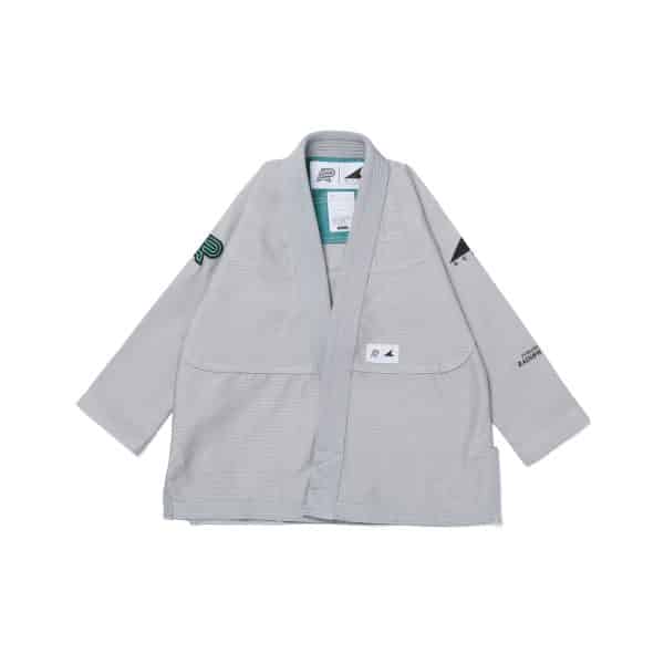 Front view of gray Albino and Preto DCDT GLM kids gi jacket with subtle branding