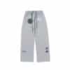 Front view of gray Albino and Preto DCDT GLM kids gi pants with drawcord and logos
