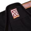 Albino and Preto B111 YBM black gi collar label with shoulder maze patch detail