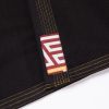 Albino and Preto B111 YBM black gi lapel label with yellow orange stitching