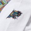 AP B108 sleeve embroidery close-up with stained glass style Albino and Preto mark